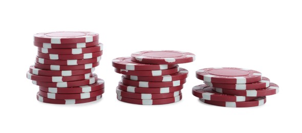 Photo of Stacks of casino poker chips on white background