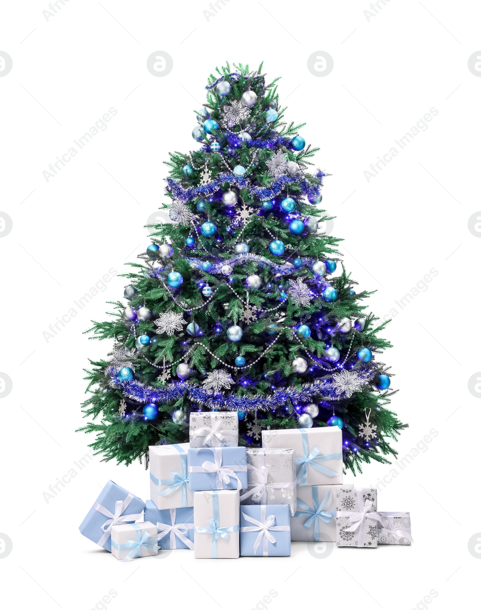 Photo of Beautiful Christmas tree and gift boxes isolated on white