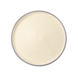 Bowl of uncooked organic semolina isolated on white, top view