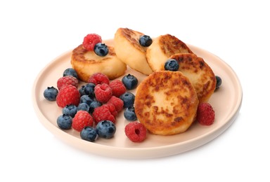 Plate with delicious cottage cheese pancakes and fresh berries on white background