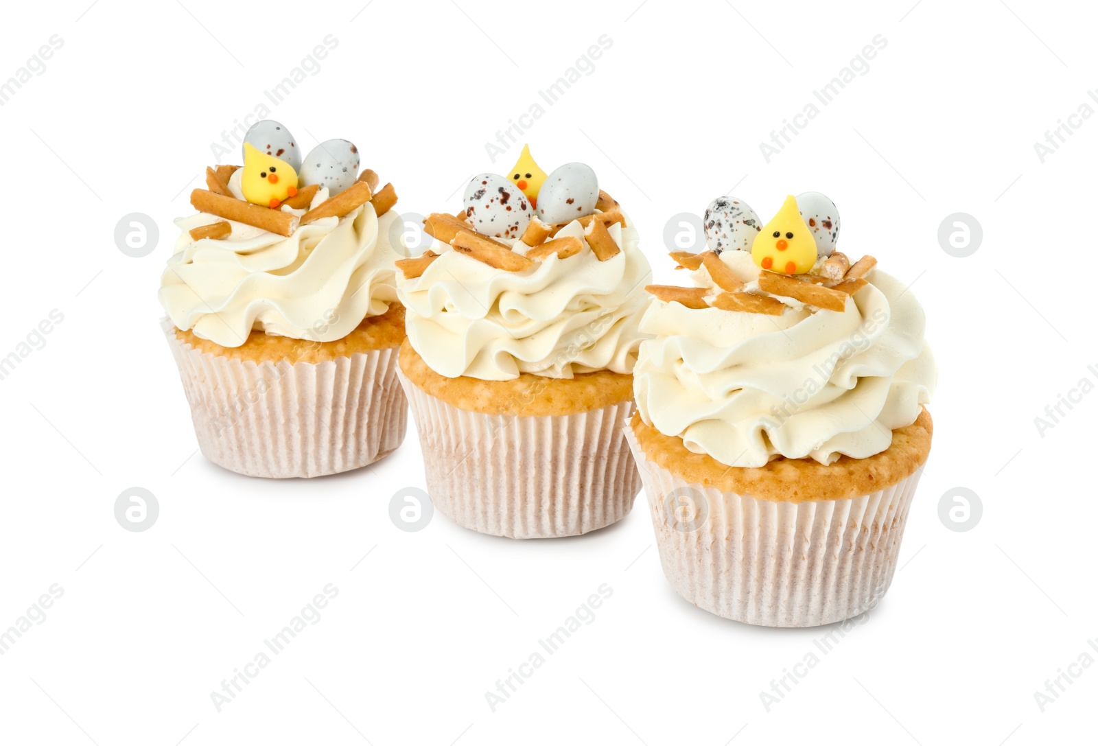 Photo of Tasty Easter cupcakes with vanilla cream isolated on white