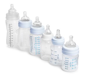 Photo of Many different empty feeding bottles for infant formula on white background