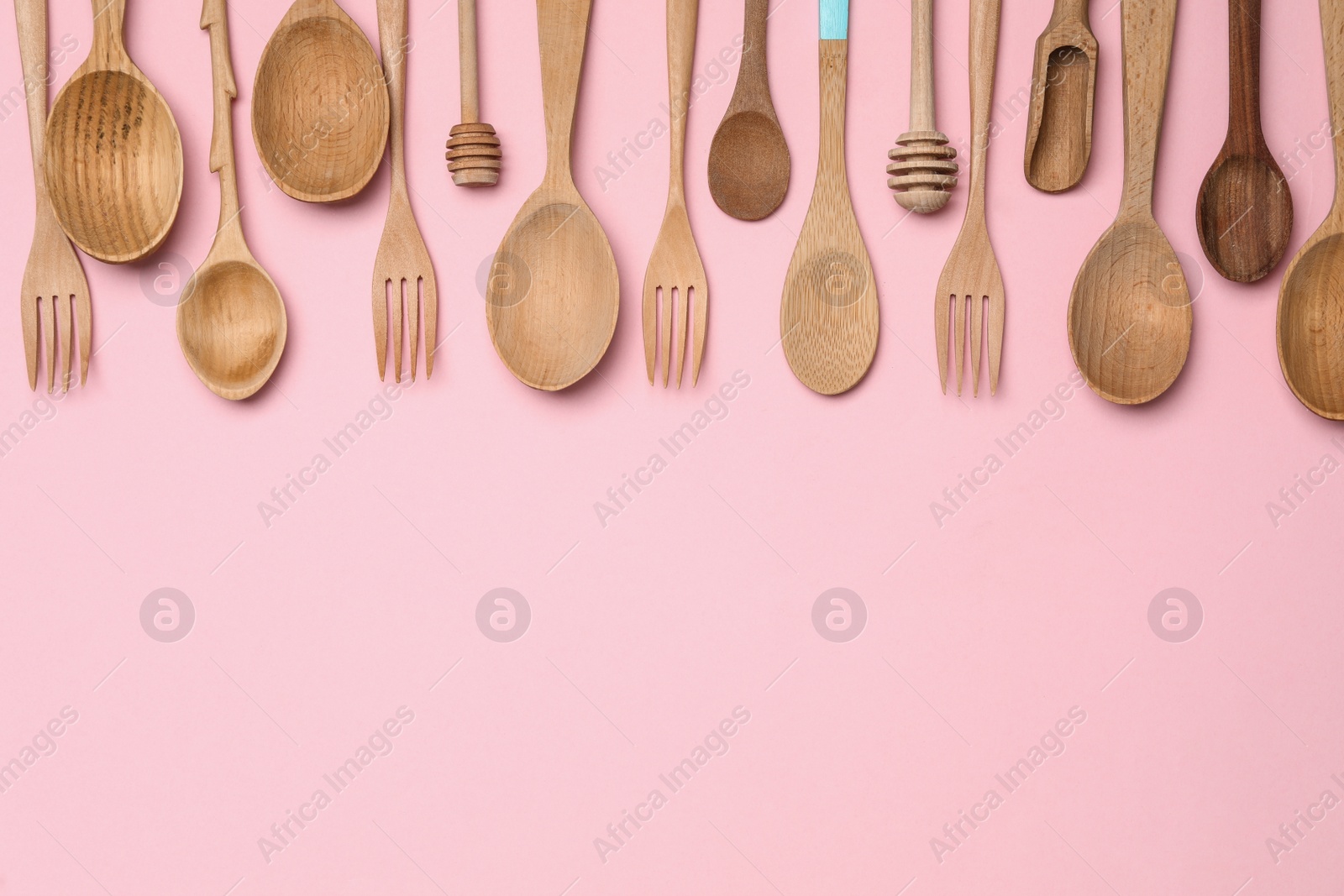 Photo of Set of modern cooking utensils on pink background, flat lay. Space for text