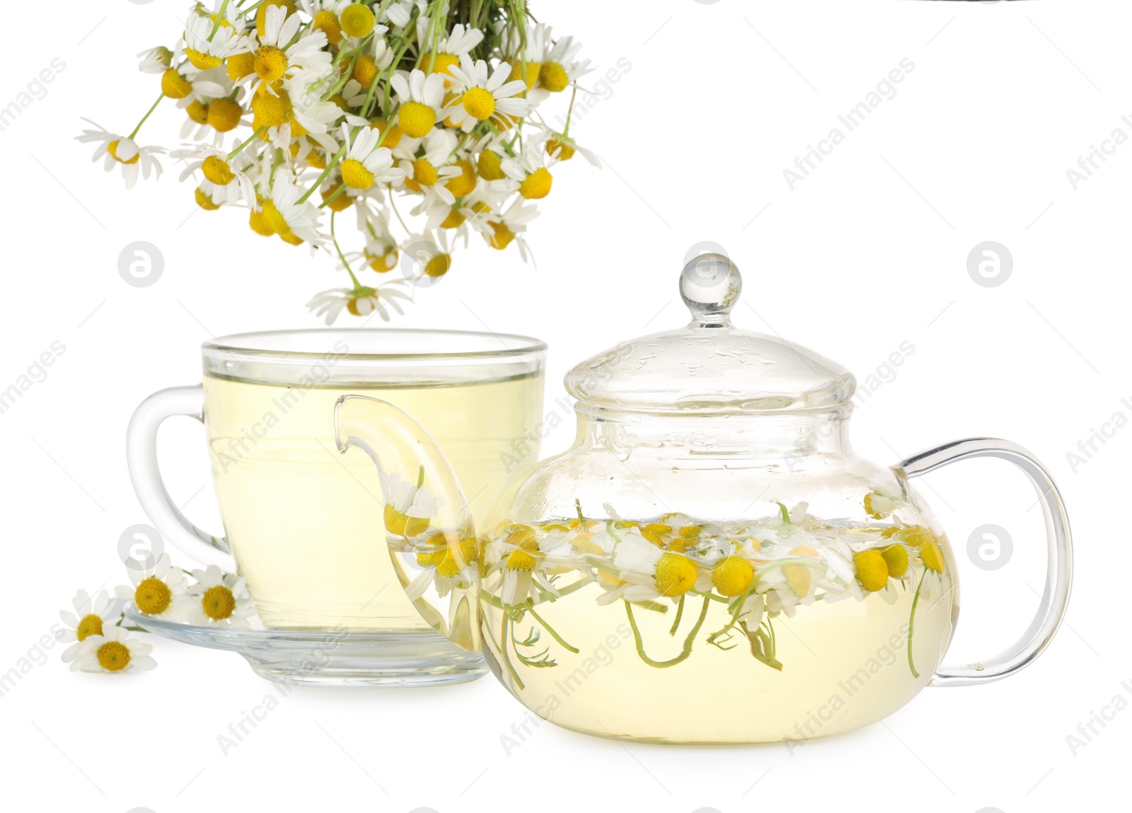 Photo of Aromatic herbal tea with chamomile flowers isolated on white