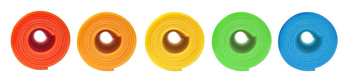 Image of Set with different bright rolled camping mats on white background. Banner design  
