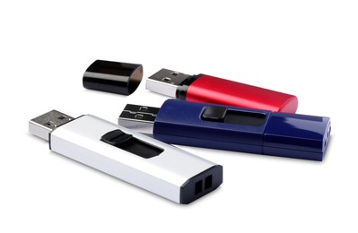 Photo of Different usb flash drives on white background