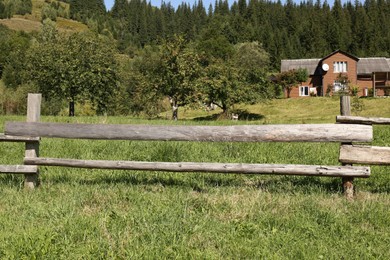Photo of Beautiful view of mountain countryside with wooden fence