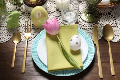 Photo of Festive table setting with beautiful tulip. Easter celebration