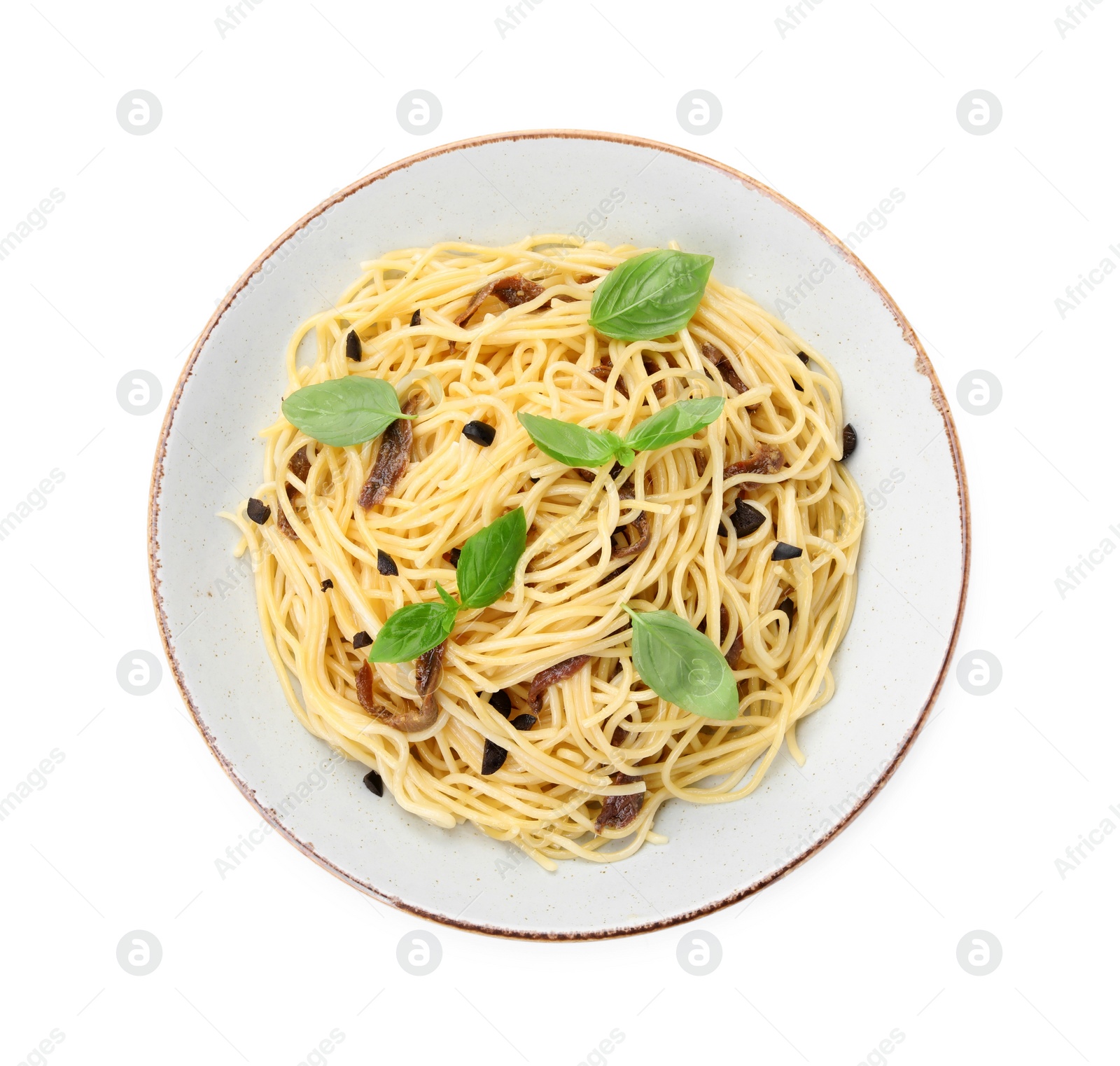 Photo of Delicious pasta with anchovies, olives and basil isolated on white, top view