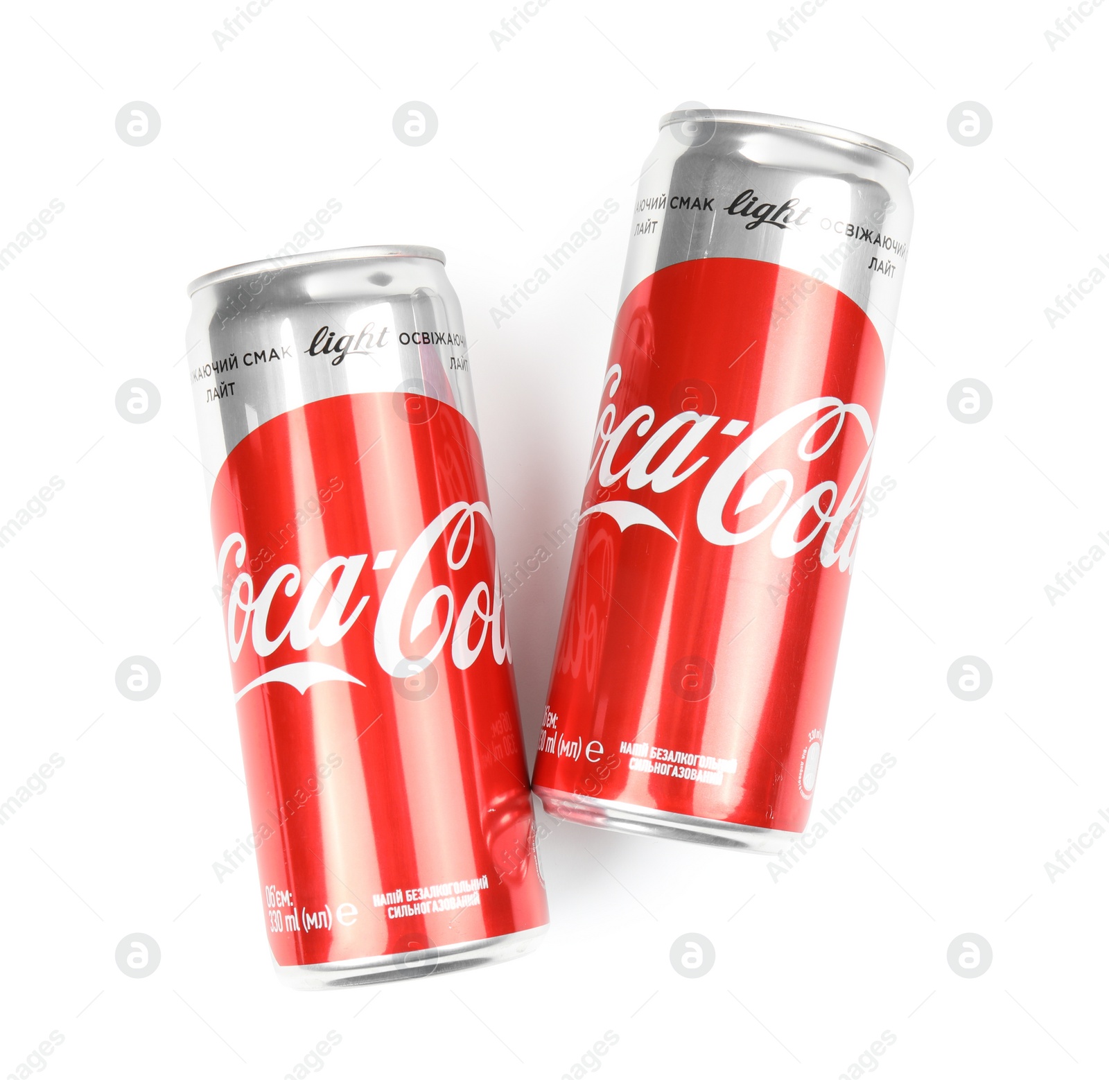 Photo of MYKOLAIV, UKRAINE - NOVEMBER 15, 2018: Coca Cola cans on white background, top view