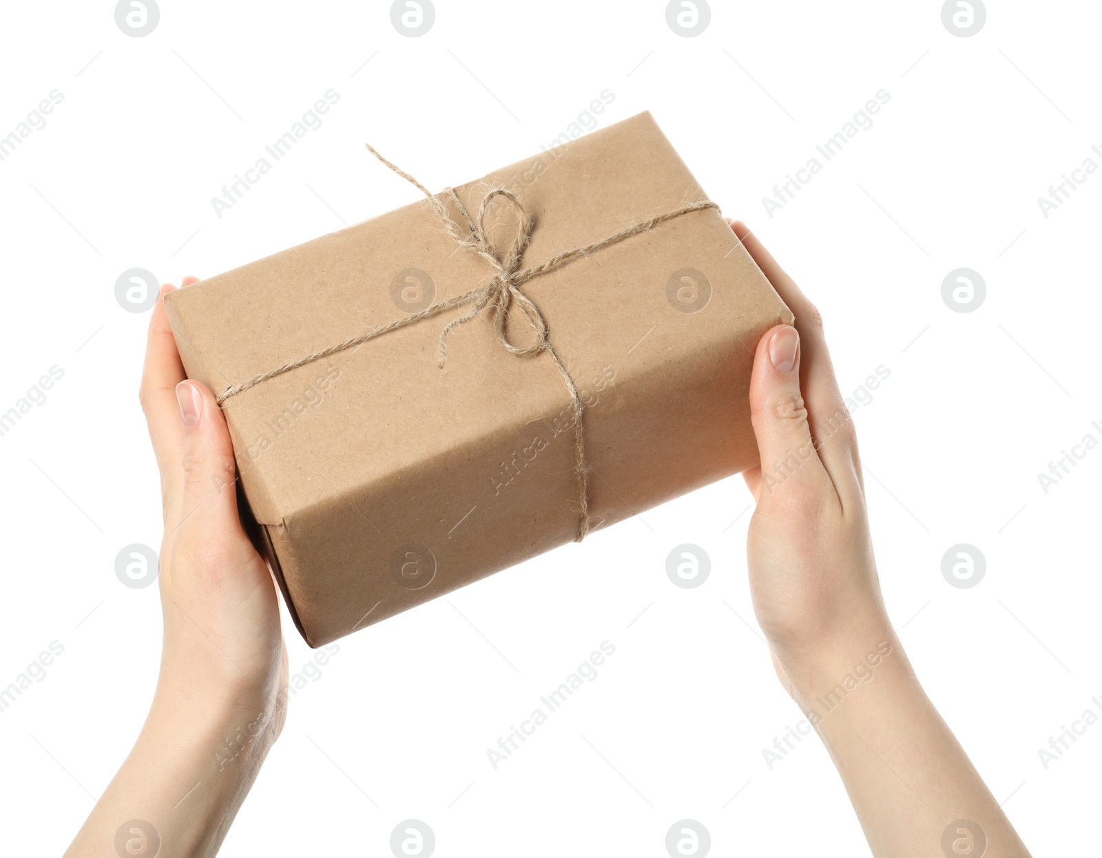 Photo of Woman holding parcel wrapped in kraft paper on white background, closeup