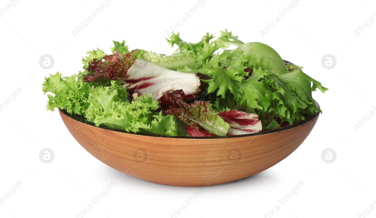 Photo of Wooden bowl with leaves of different lettuce on white background