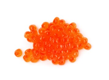 Photo of Pile of delicious red caviar isolated on white, top view