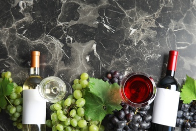 Photo of Flat lay composition with fresh ripe juicy grapes and space for text on table