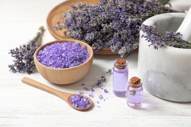 Photo of Composition with natural cosmetic products and lavender flowers on white wooden background