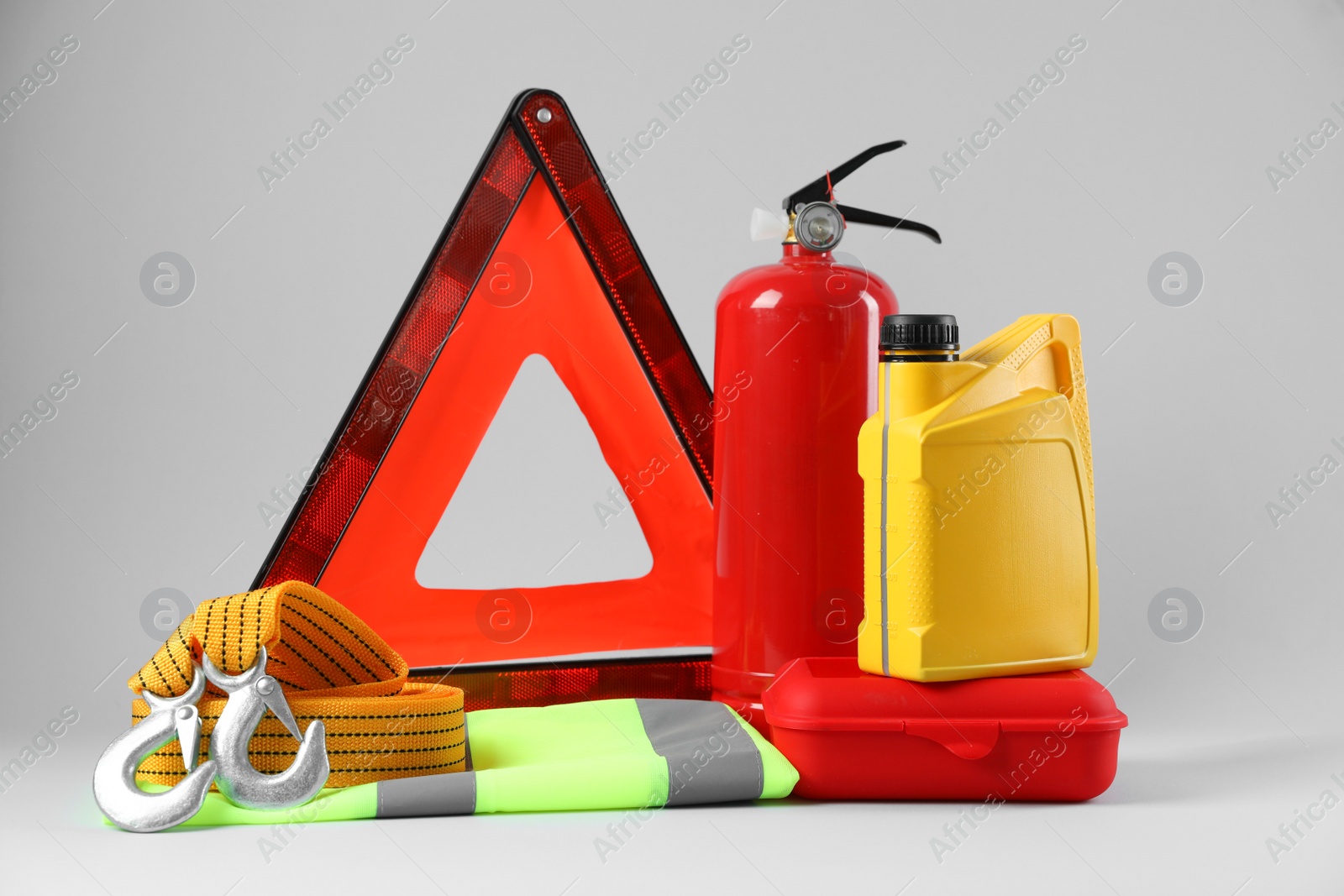 Photo of Set of car safety equipment on light grey background