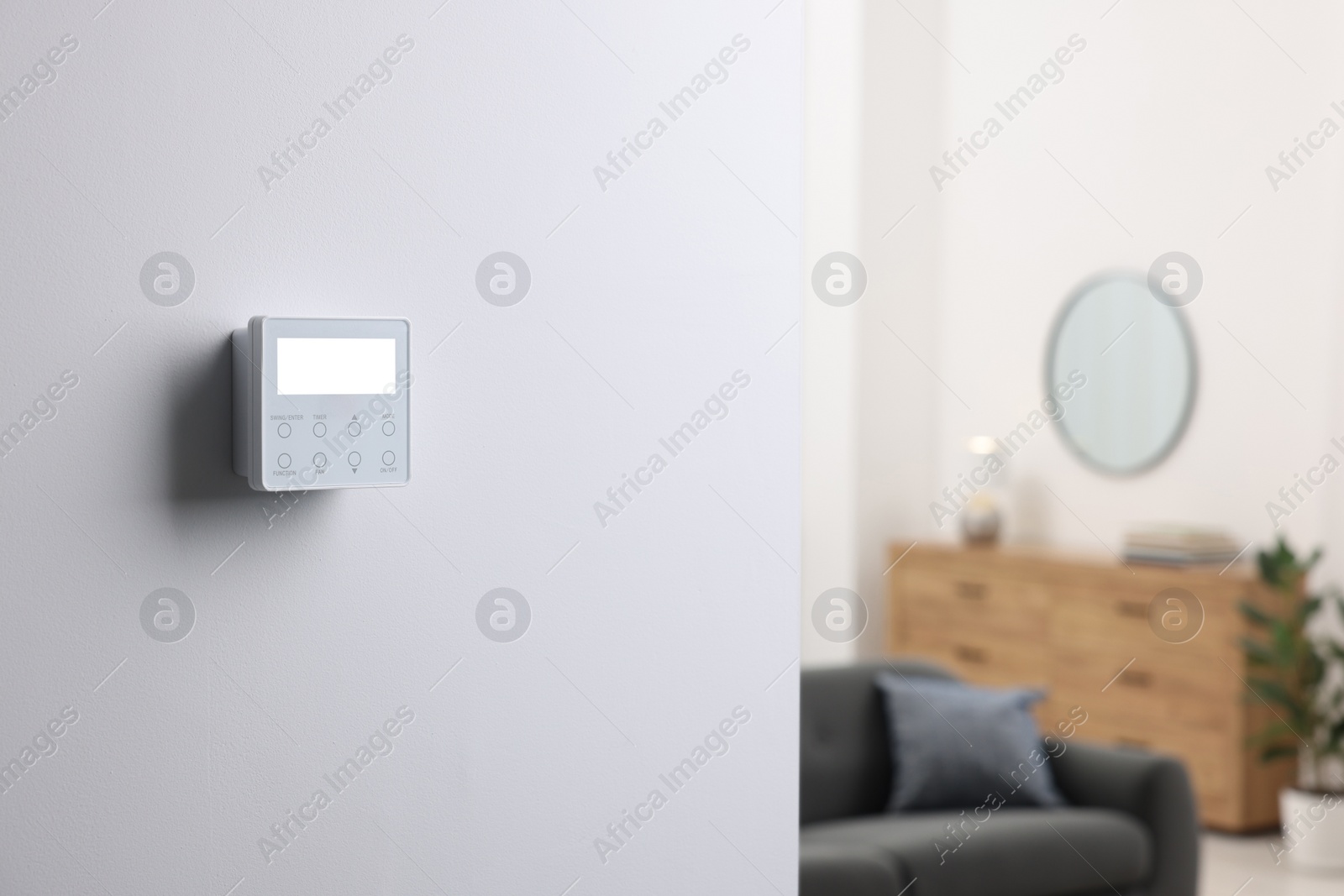 Photo of One thermostat on white wall indoors, space for text. Smart home system