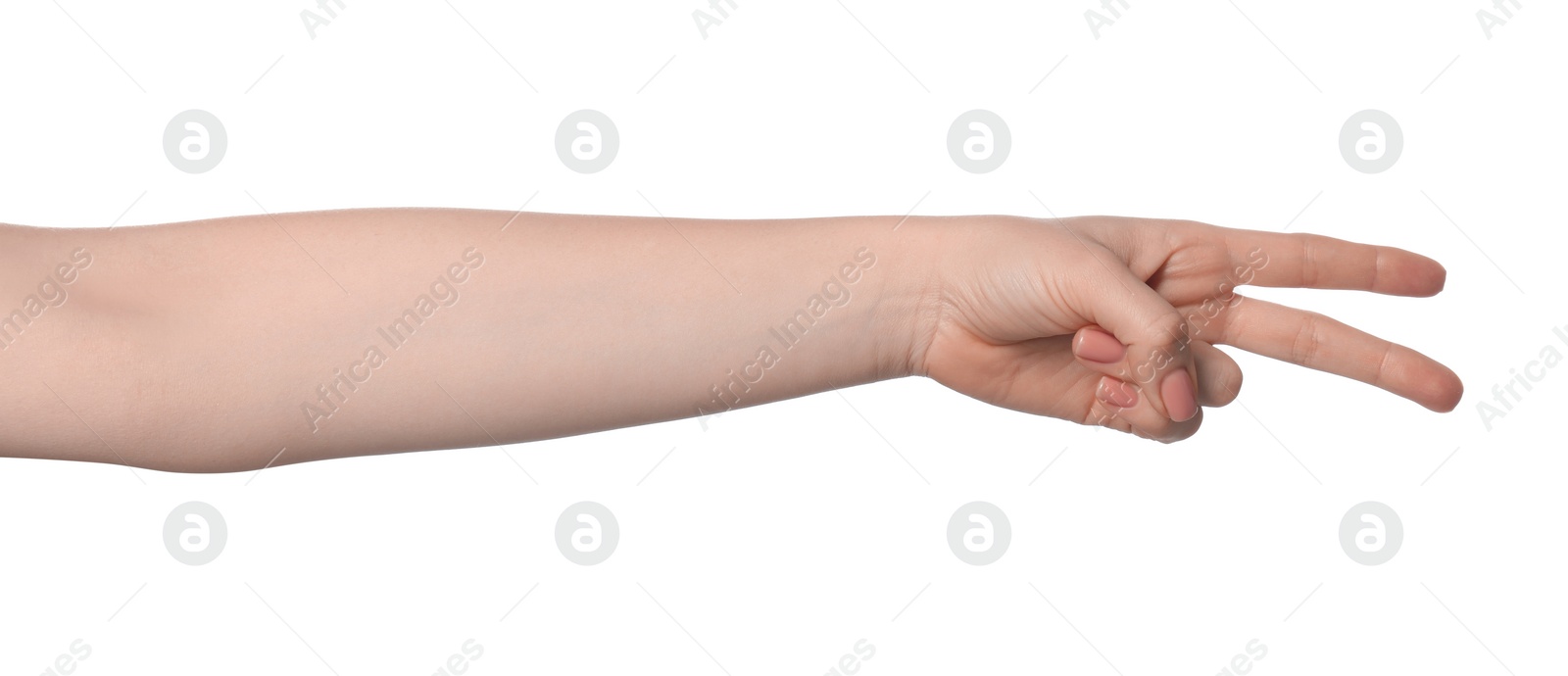 Photo of Playing rock, paper and scissors. Woman making scissors with her fingers on white background, closeup