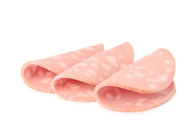 Slices of delicious boiled sausage on white background