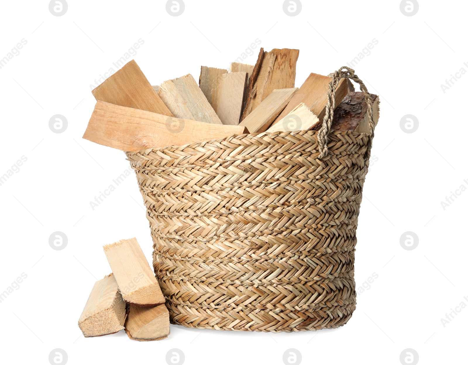 Photo of Wicker basket with cut firewood isolated on white