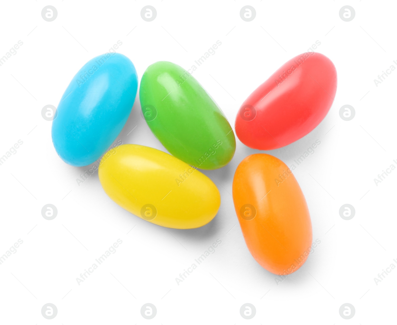 Photo of Pile of tasty bright jelly beans isolated on white, top view