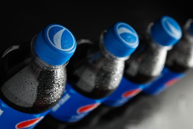 Photo of MYKOLAIV, UKRAINE - FEBRUARY 08, 2021: Plastic bottles of Pepsi with water drops, closeup