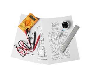 Photo of Wiring diagrams, digital multimeter, tape measure and ruler isolated on white, top view