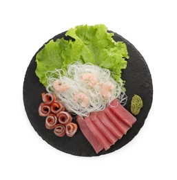 Photo of Sashimi set (raw tuna, salmon slices and shrimps ) served with funchosa, lettuce and vasabi isolated on white, top view