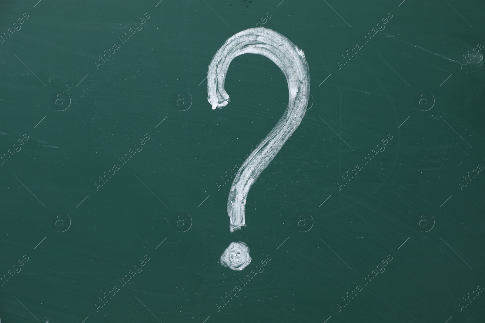 Photo of Question mark drawn by chalk on green board