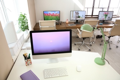 Stylish workplace with computer on table