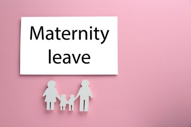 Photo of Note with words Maternity Leave and figures of family on pink background, flat lay. Space for text