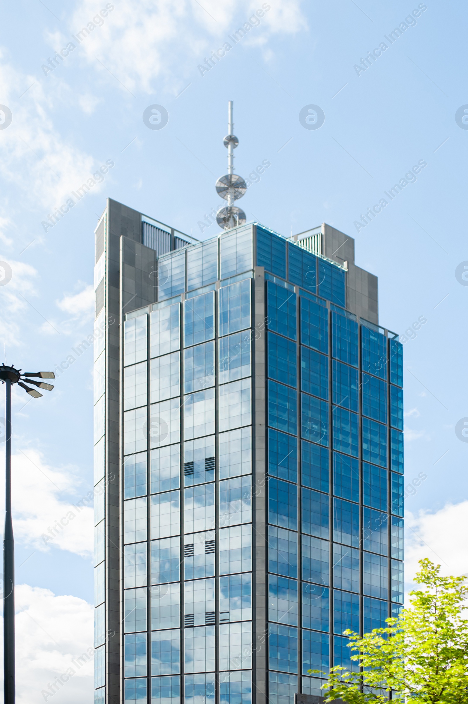 Photo of Beautiful building with many windows under cloudy sky