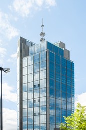 Beautiful building with many windows under cloudy sky