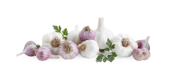 Photo of Fresh garlic heads and parsley isolated on white