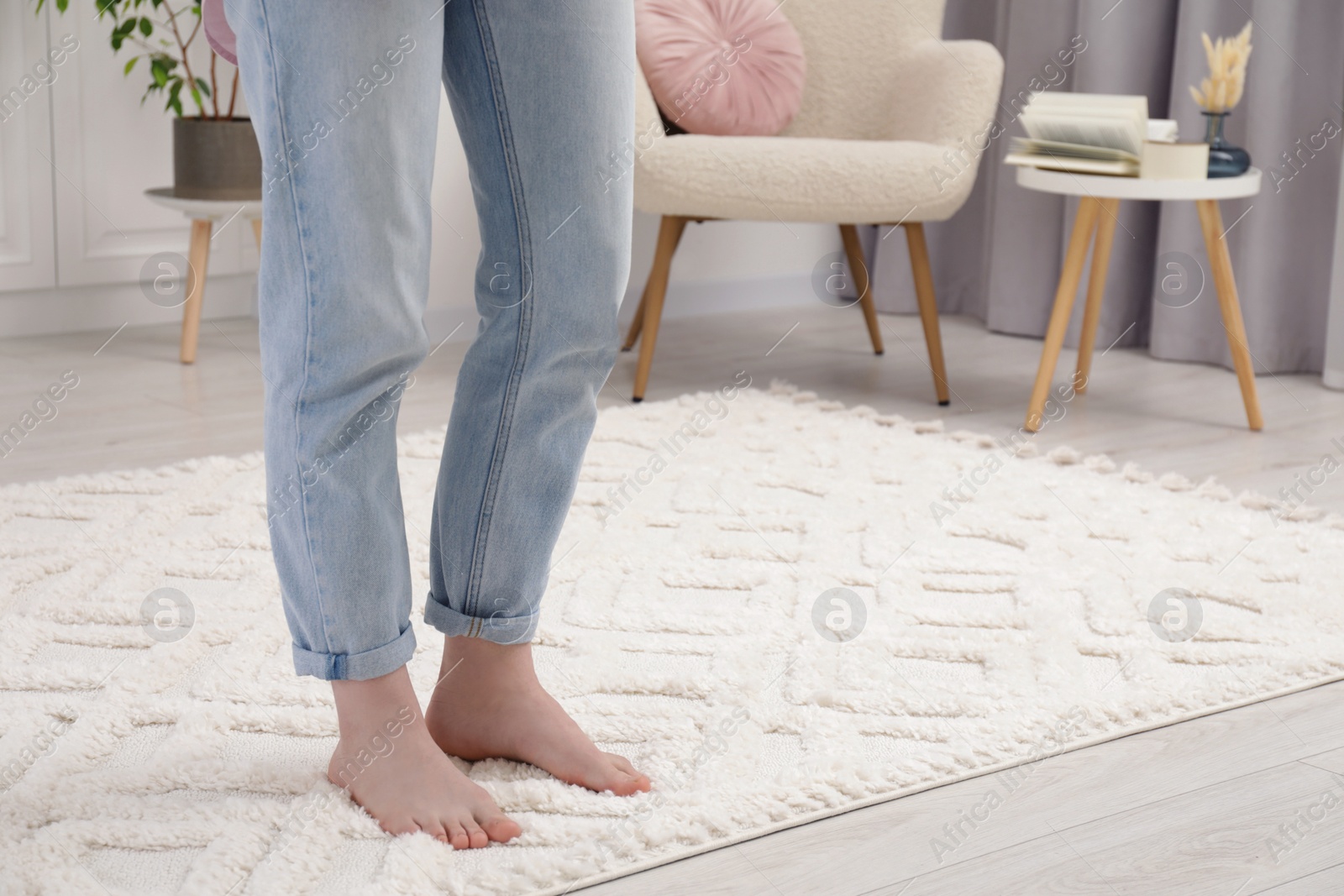 Photo of Woman standing on beige carpet in room, closeup. Space for text