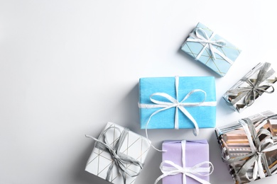 Beautiful gift boxes on white background, top view