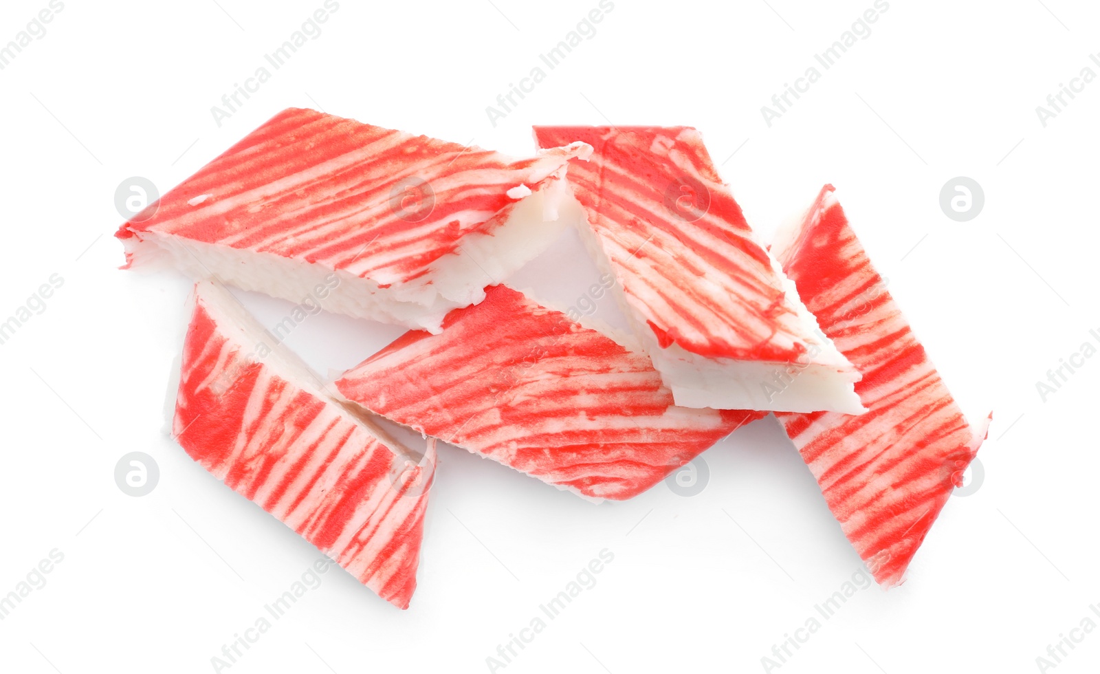 Photo of Pieces of crab sticks isolated on white, top view