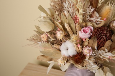 Photo of Beautiful dried flower bouquet in vase on table, closeup