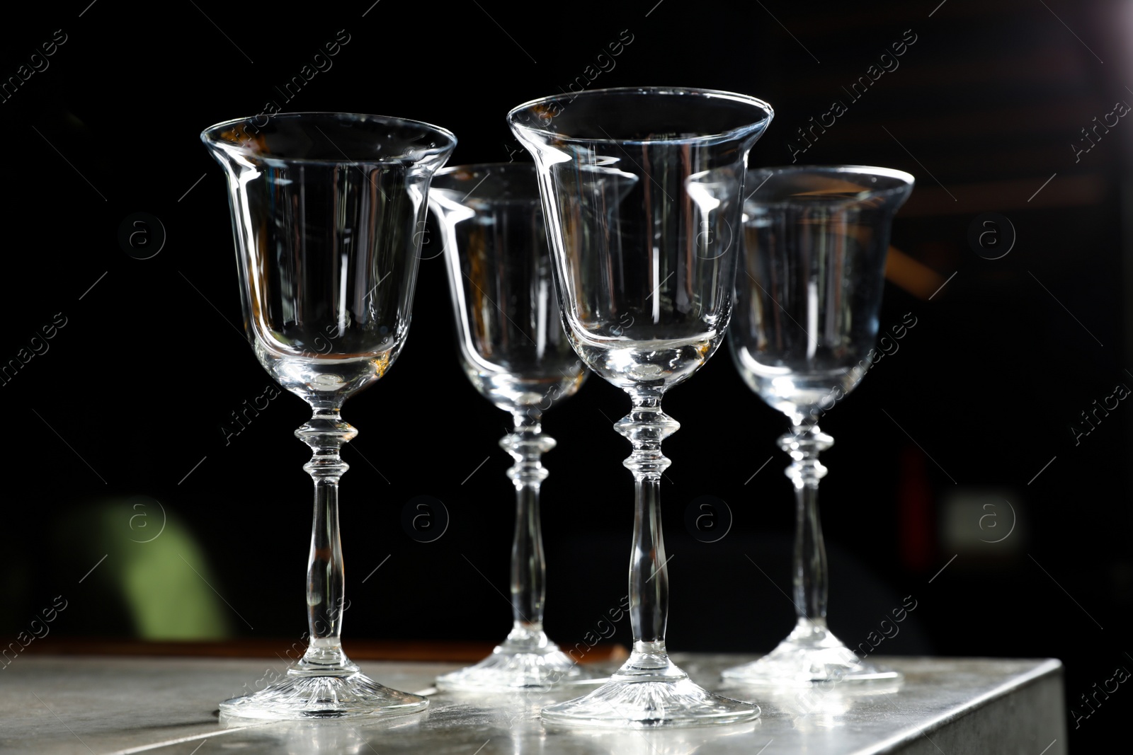 Photo of Empty clean glasses on counter in bar