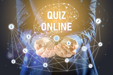 Image of Quiz online. Man demonstrating icons on virtual screen against dark background, closeup 