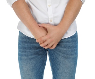 Photo of Man suffering from pain on white background, closeup. Urology problems