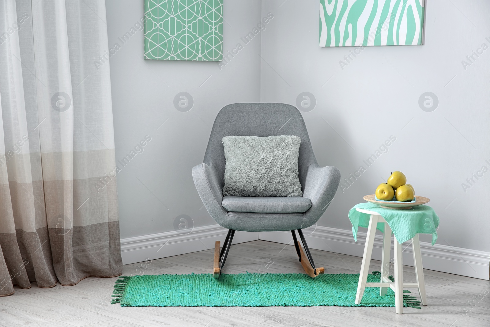 Photo of Living room interior with comfortable armchair. Mint color decors
