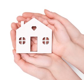 Photo of Home security concept. Woman and her little child holding house model on white background, top view with space for text