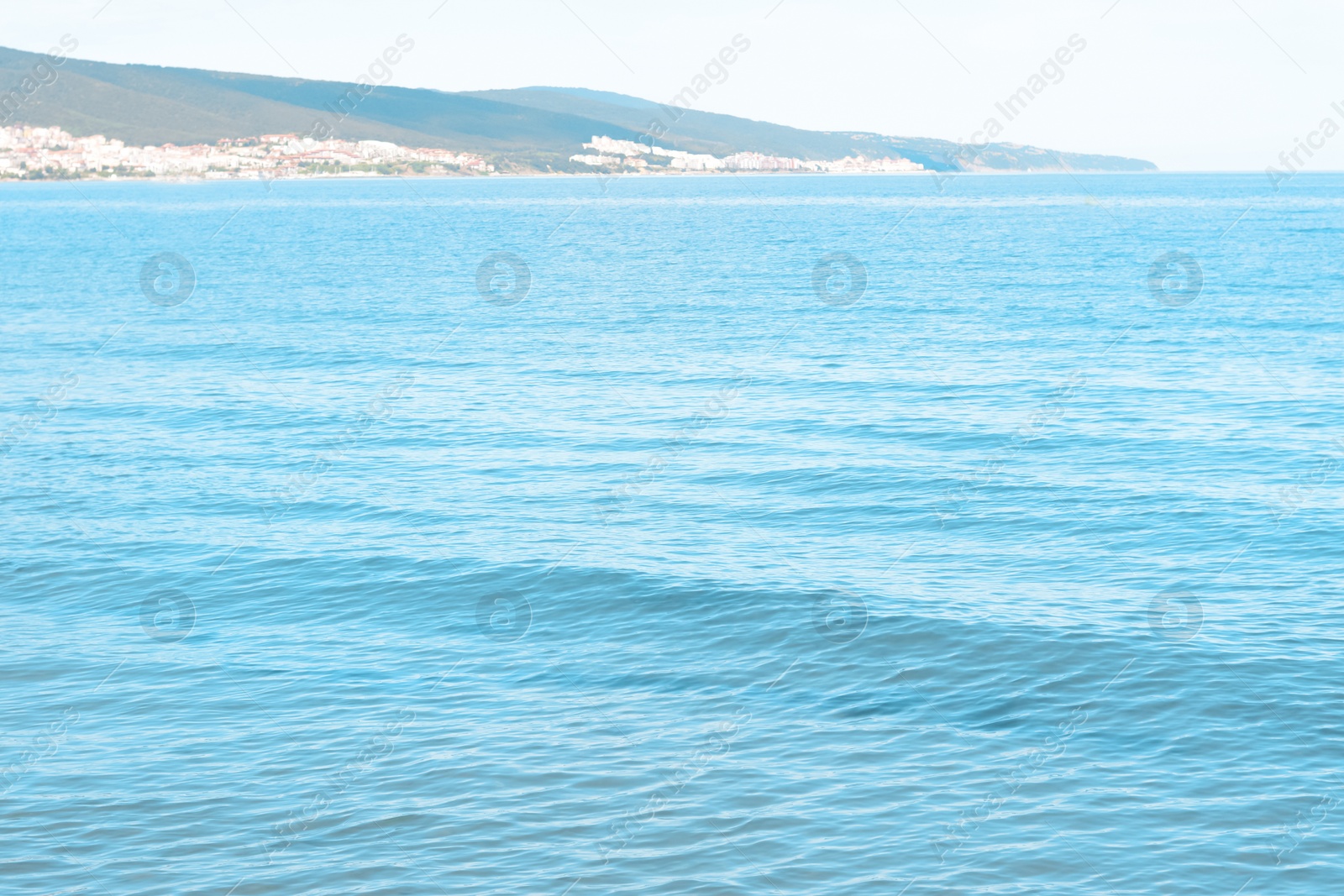 Photo of Picturesque view of beautiful sea water and distant city