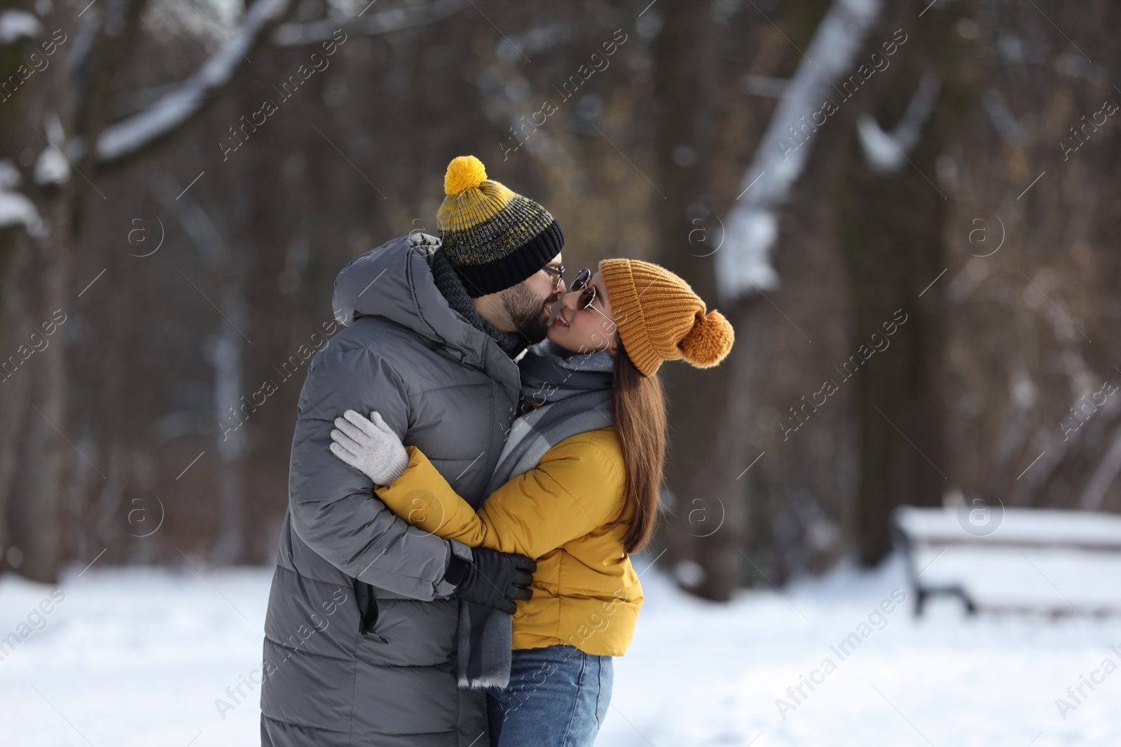 Photo of Beautiful happy couple outdoors on winter day. Space for text