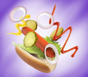 Hot dog ingredients in air on indigo gradient background