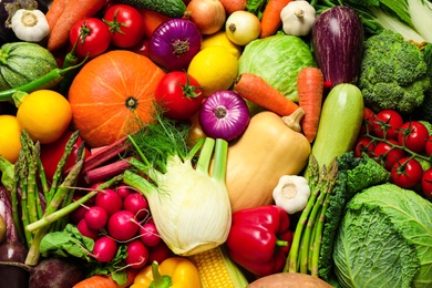Photo of Many fresh vegetables as background, top view