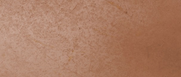 Shiny bronze surface as background, closeup view