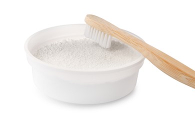 Bowl of tooth powder and brush on white background