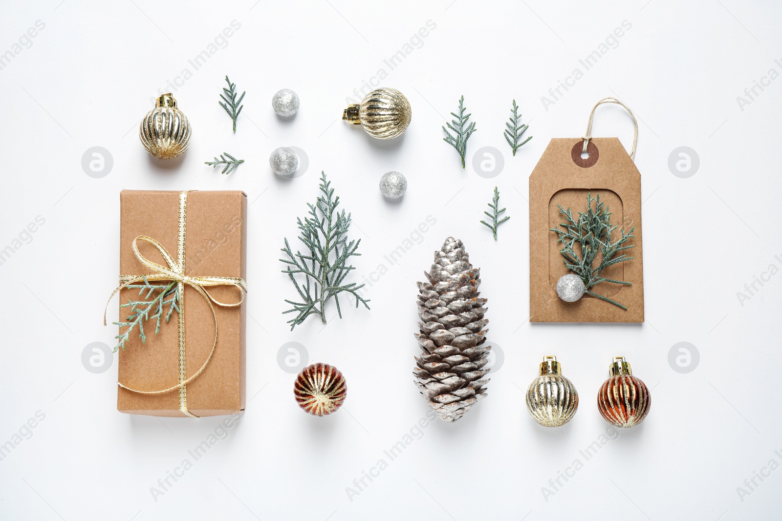 Photo of Flat lay composition with Christmas gift and festive decor on white background